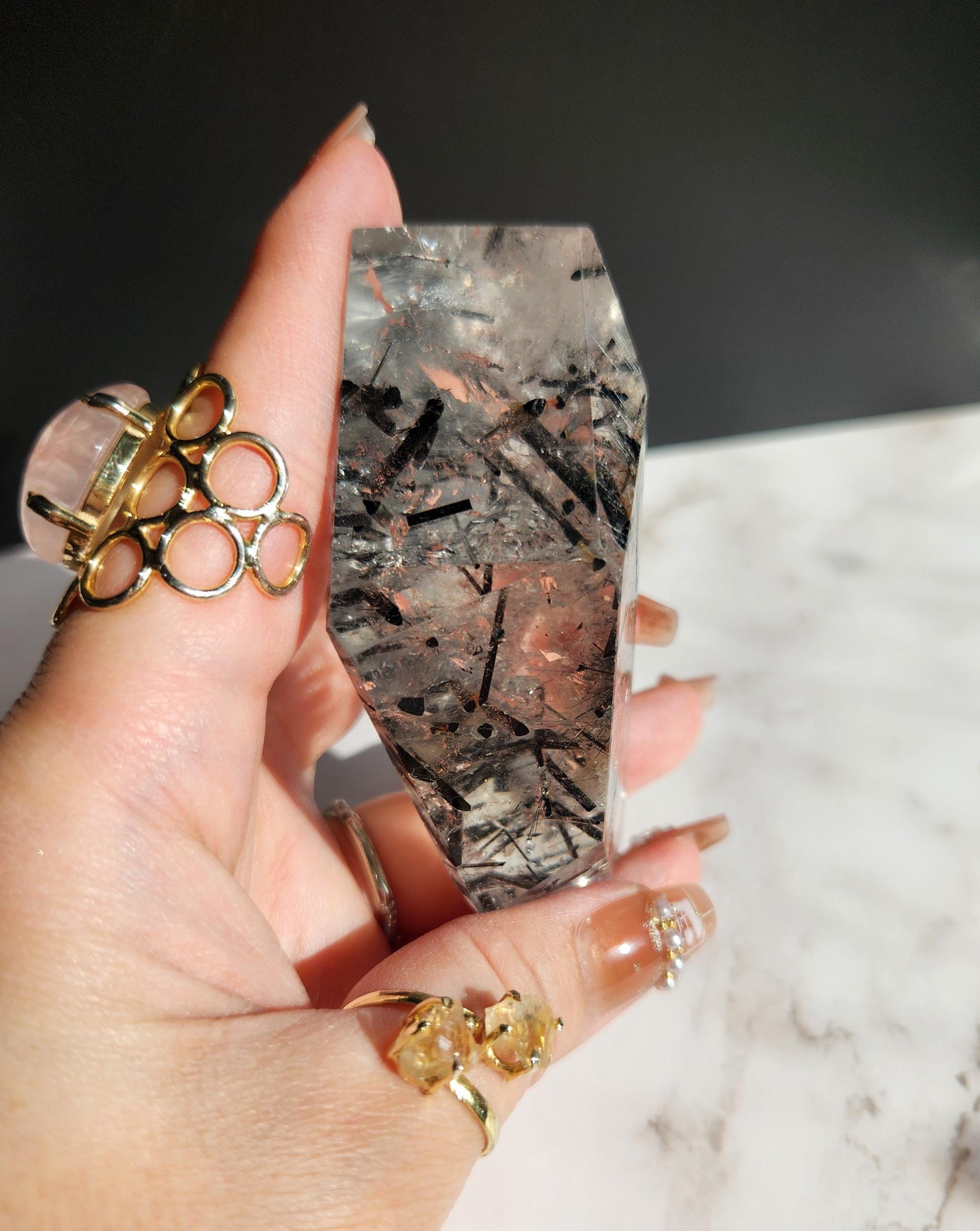 High quality black rutile freefrom on gold custom stand