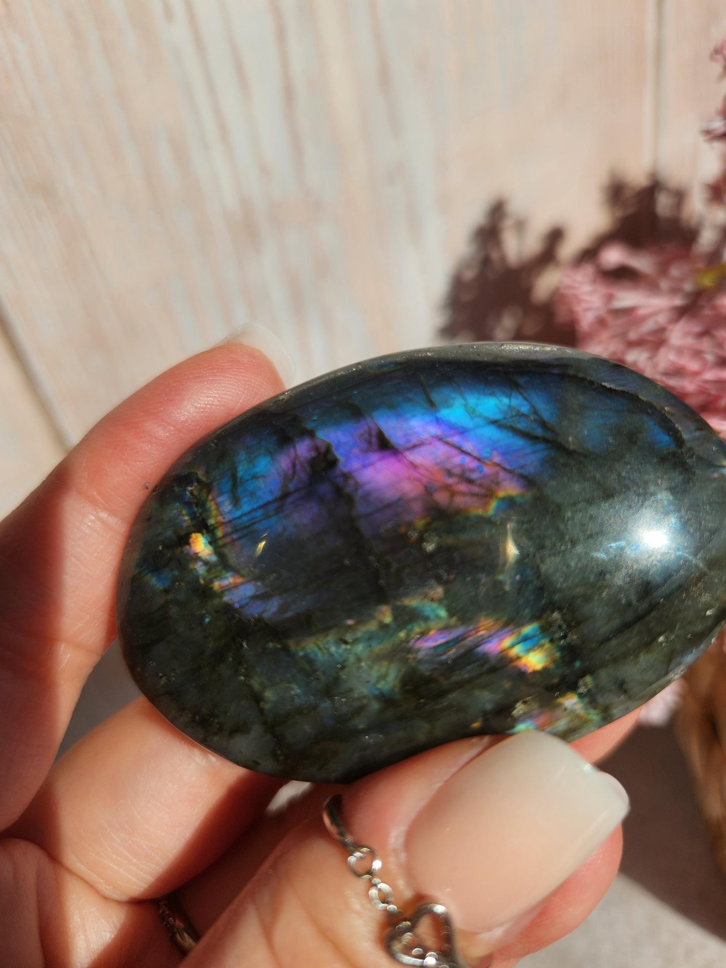 AAA Rainbow purple labradorite palm stone with silver sheen from Finland