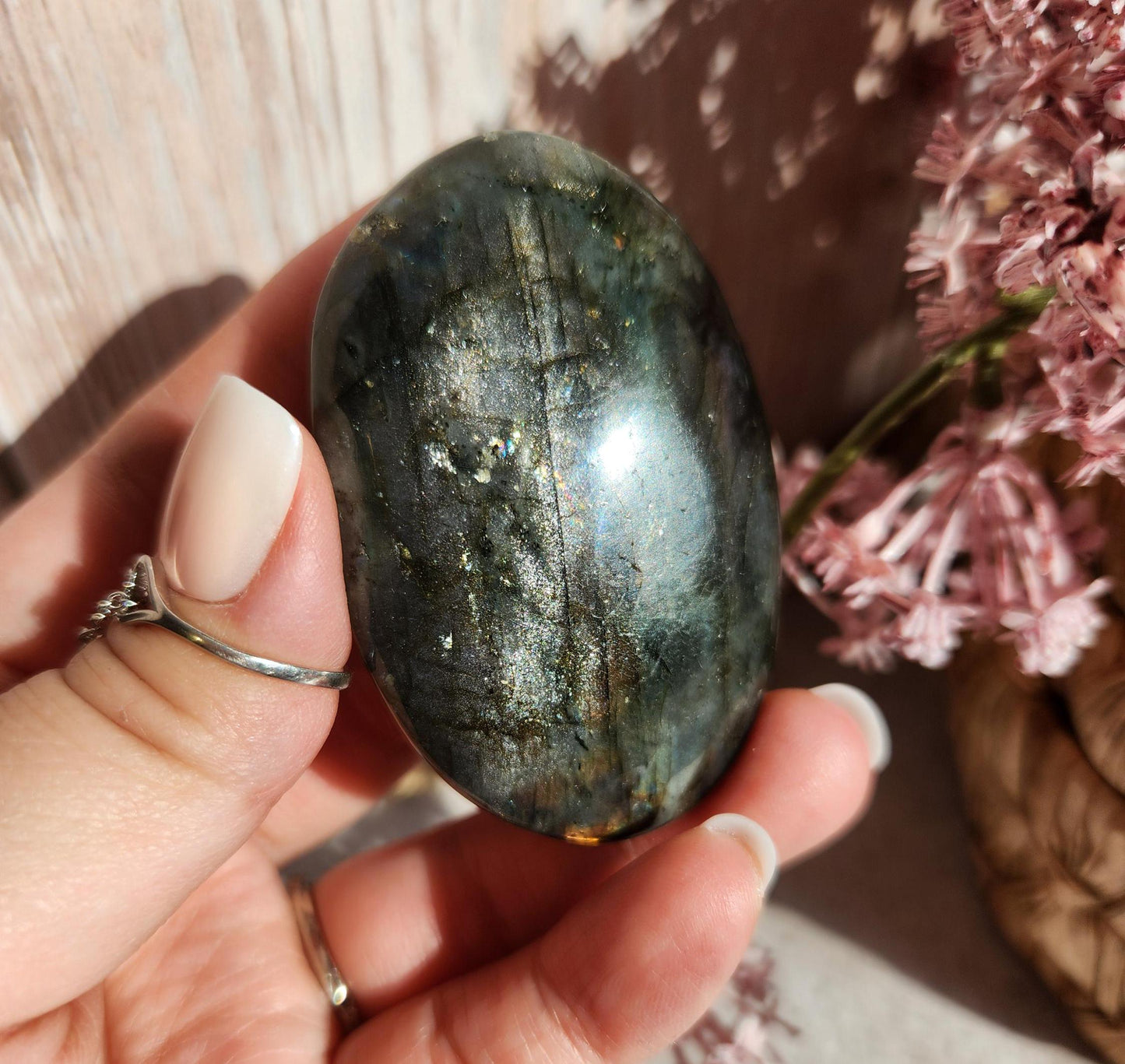 AAA Rainbow purple labradorite palm stone with silver sheen from Finland