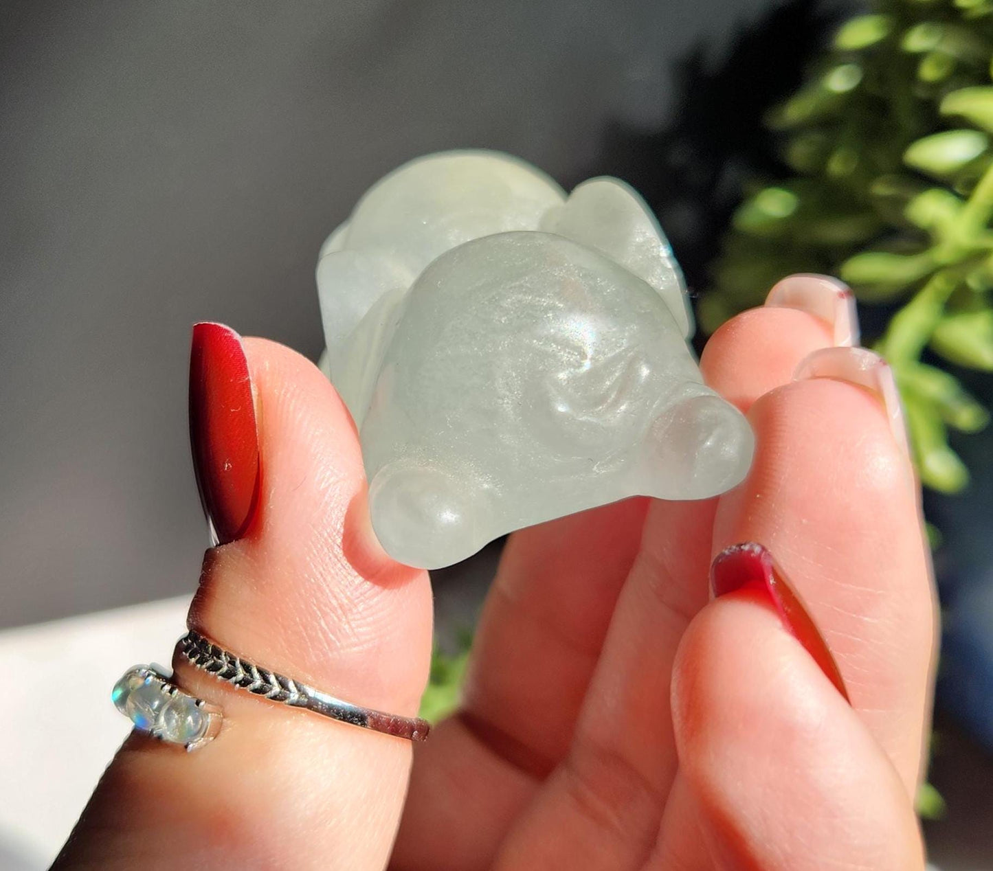 Adorable light green fluorite elephant, laying down elephant carving