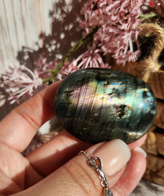 Beautiful bright silver and purple labradorite palm stone from Finland