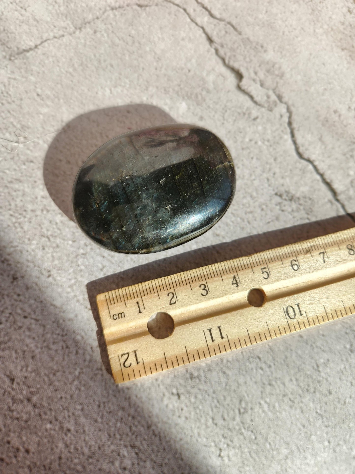 Stunning blue, silver purple labradorite palm stone from Finland