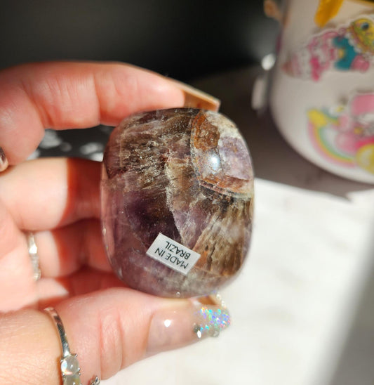 Rare natural super seven palm stone  from Brazil  26D