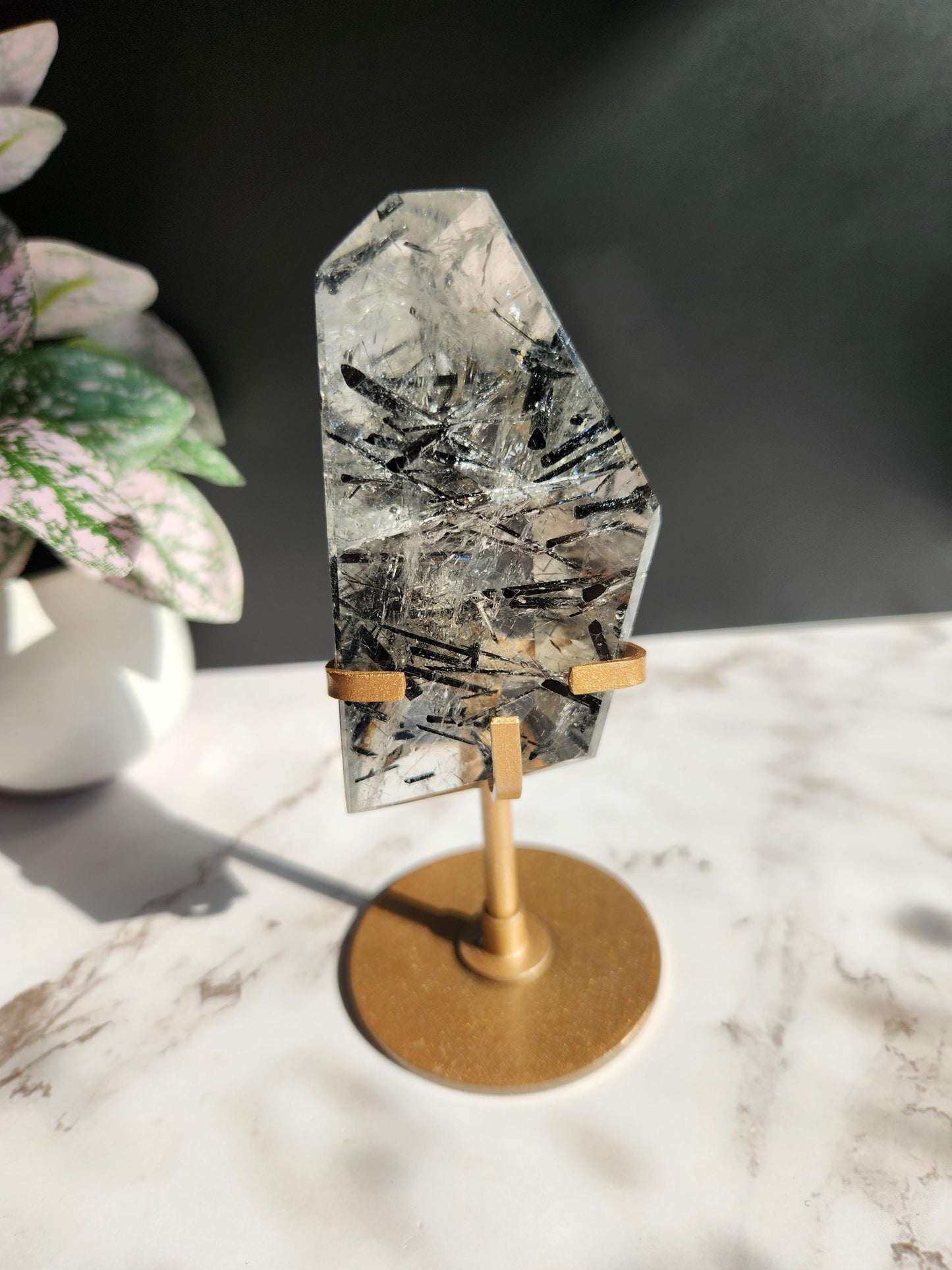High quality black tourmaline in quartz  freefrom with rainbows on a beautiful gold custom stand