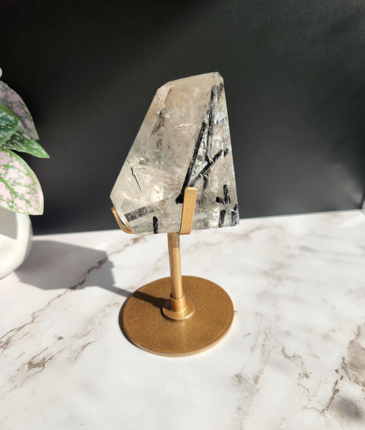 High quality black tourmaline in quartz  freefrom with rainbows on a beautiful gold custom stand