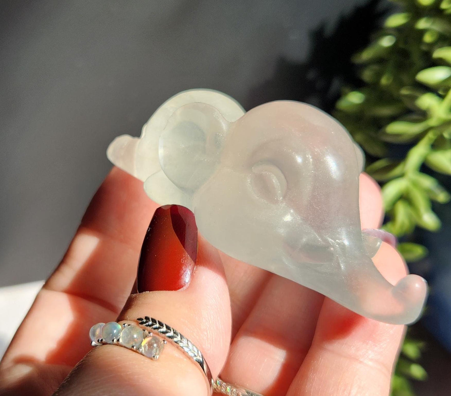 Adorable light green fluorite elephant, laying down elephant carving