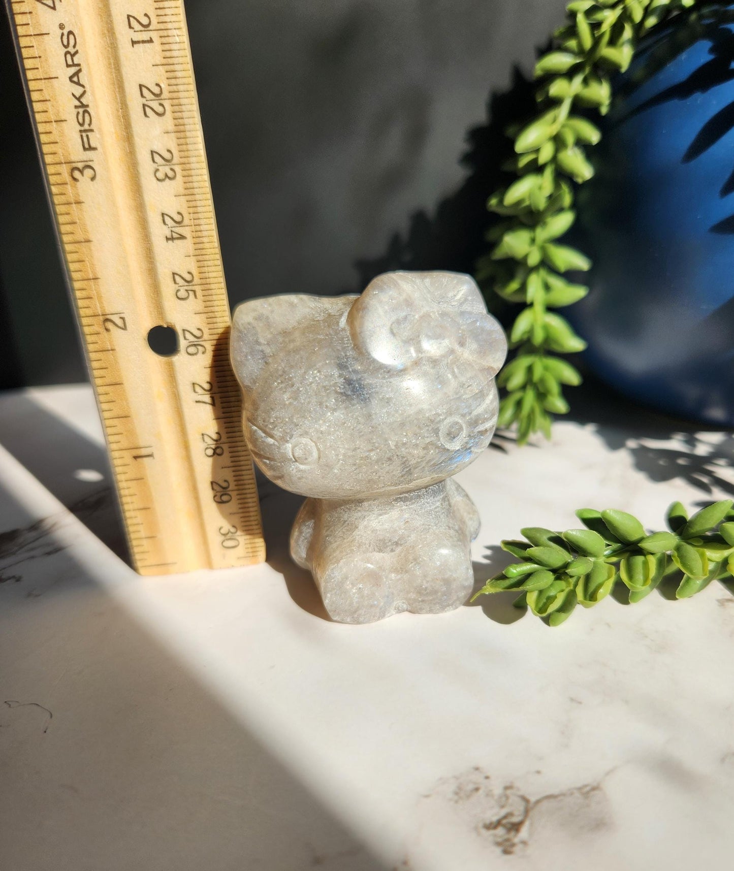 Beautiful blue moonstone hello kitty carving with amazing blue flash