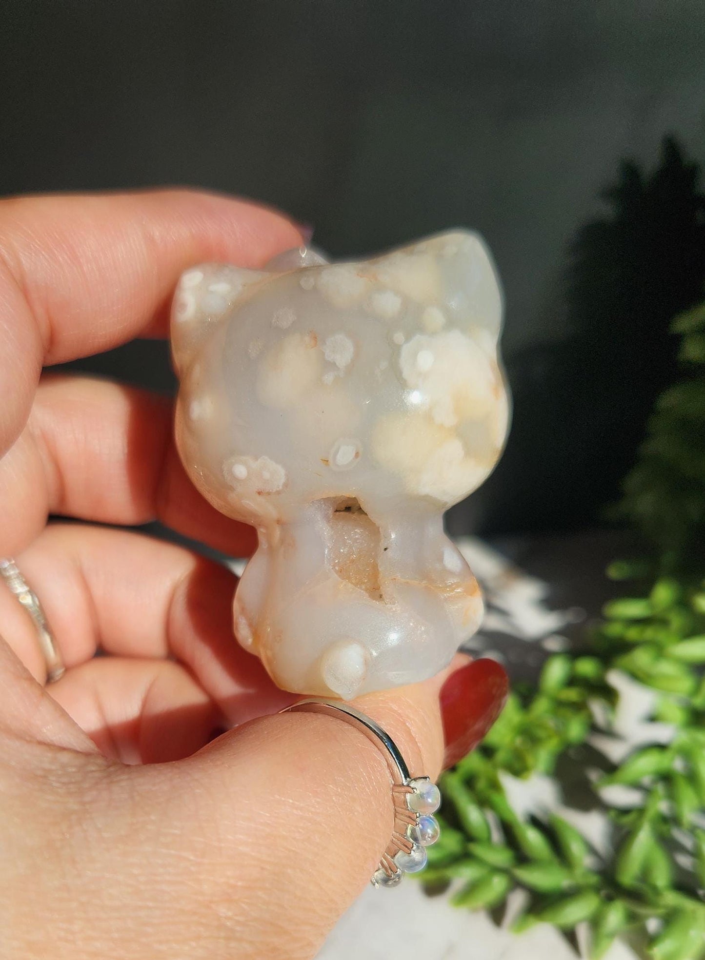 Beautiful flower agate hello kitty carving with a druzy, natural