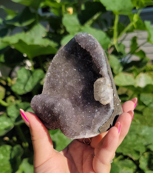 Lavender gray rainbow amethyst cutbase with calcite from Uruguay, natural color