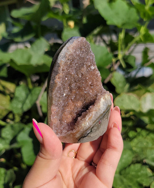 Sparkly rainbow amethyst cutbase from Uruguay, natural color
